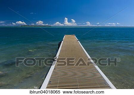 "Pier with Cocos island in the back, Cocos Lagoon, Merizo, Guam, US Territory, Pacific, Oceania" View Large Photo Image Stock Photography - "Pier with Cocos island in the back, Cocos Lagoon, Merizo, Guam, US Territory, Pacific, Oceania". Fotosearch