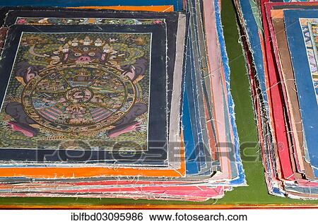 "Pile of small Thangkas for sale in one of the art schools near Boudnath Stupa, Kathmandu Valley, Kathmandu, Kathmandu District, Bagmati Zone, Nepal, Asia" View Large Photo Image Stock Photograph - "Pile of small Thangkas for sale in one of the art schools near Boudnath Stupa, Kathmandu Valley, Kathmandu, Kathmandu District, Bagmati Zone, Nepal, Asia". Fotosearch