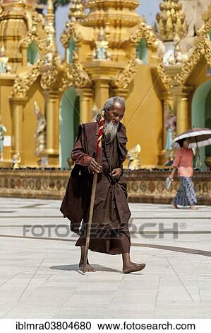 "Pilgrim, Buddhist monk circling the Shwedagon Pagoda during meditation, Yangon, Myanmar, Asia" View Large Photo Image Stock Image - "Pilgrim, Buddhist monk circling the Shwedagon Pagoda during meditation, Yangon, Myanmar, Asia". Fotosearch