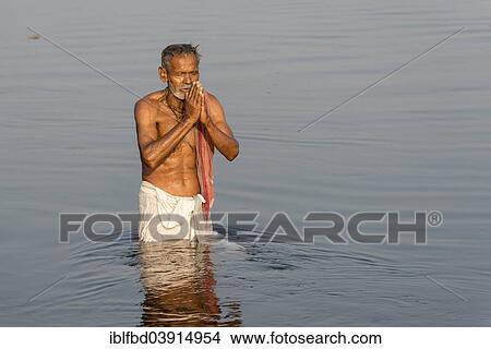 "Pilgrim taking a bath praying in the holy Yamuna river, Vrindavan, Uttar Pradesh, India, Asia" View Large Photo Image Picture - "Pilgrim taking a bath praying in the holy Yamuna river, Vrindavan, Uttar Pradesh, India, Asia". Fotosearch