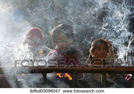 Stock Photo - "Pilgrims burning incense as an offering, Dakshinkali Temple or Dakshin Kali Temple, Kathmandu Valley, Dakshinkali, Kathmandu District, Bagmati Zone, Nepal, Asia". Fotosearch