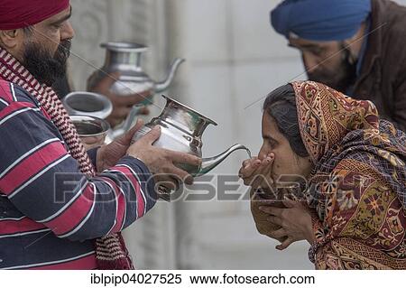 "Pilgrims drinking holy water, Bangla Sahib Gurudwara, Sikh temple, Delhi, India, Asia" View Large Photo Image Stock Photography - "Pilgrims drinking holy water, Bangla Sahib Gurudwara, Sikh temple, Delhi, India, Asia". Fotosearch