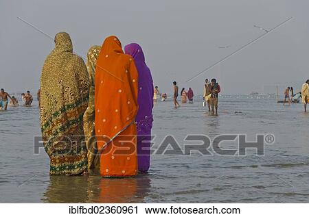 "Pilgrims standing in the water at Sangam, the confluence of the holy rivers Ganges, Yamuna and Saraswati, Allahabad, India, Asia" View Large Photo Image Stock Image - "Pilgrims standing in the water at Sangam, the confluence of the holy rivers Ganges, Yamuna and Saraswati, Allahabad, India, Asia". Fotosearch