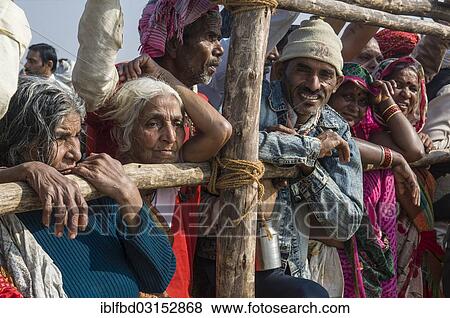 Stock Photo - "Pilgrims watching the procession of Shahi Snan, the royal bath, during Kumbha Mela festival, Allahabad, Uttar Pradesh, India, Asia". Fotosearch