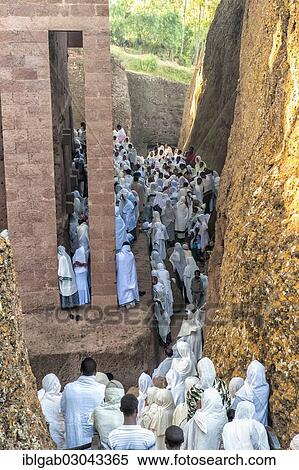 Stock Photography - "Pilgrims wearing a traditional white shawl attending a ceremony at the Bete Medhane Alem Church, UNESCO World Heritage Site, Lalibela, Amhara Region, Ethiopia, Africa". Fotosearch
