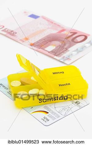 "Pill boxes with tablets, a health insurance card from AOK health insurance and a 10 euro banknote for consultation fees" View Large Photo Image Stock Image - "Pill boxes with tablets, a health insurance card from AOK health insurance and a 10 euro banknote for consultation fees". Fotosearch