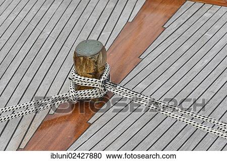 Pillar for ropes on a wooden boat View Large Photo Image Stock Image - Pillar for ropes on a wooden boat. Fotosearch