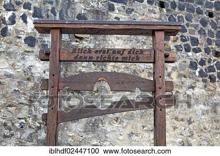 "Pillory from the Middle Ages with the inscription """"Blick erst auf dich, dann richte mich"""", German for """"look at yourself first, then judge me"""", Burg Greifenstein Castle, Greifenstein, Hesse, Germany, Europe" View Large Photo Image Stock Image - "Pillory from the Middle Ages with the inscription """"Blick erst auf dich, dann richte mich"""", German for """"look at yourself first, then judge me"""", Burg Greifenstein Castle, Greifenstein, Hesse, Germany, Europe". Fotosearch