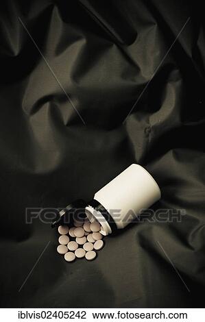 Pills spilled from plastic container View Large Photo Image Stock Image - Pills spilled from plastic container. Fotosearch