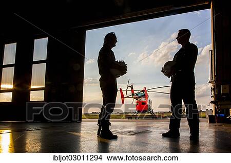 "Pilots during a meeting before take-off, police helicopter type BK 117, Police Flying Squadron NRW, North Rhine-Westphalia, Germany, Europe" View Large Photo Image Picture - "Pilots during a meeting before take-off, police helicopter type BK 117, Police Flying Squadron NRW, North Rhine-Westphalia, Germany, Europe". Fotosearch