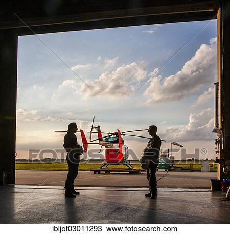 "Pilots during a meeting before take-off, police helicopter type BK 117, Police Flying Squadron NRW, North Rhine-Westphalia, Germany, Europe" View Large Photo Image Stock Image - "Pilots during a meeting before take-off, police helicopter type BK 117, Police Flying Squadron NRW, North Rhine-Westphalia, Germany, Europe". Fotosearch