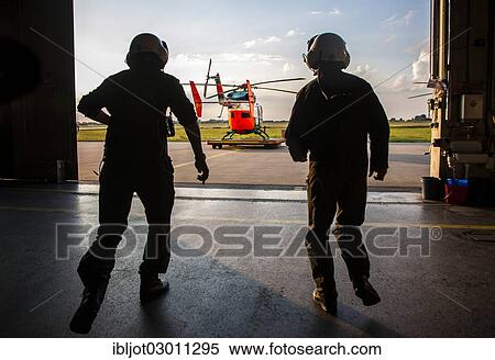 "Pilots sprinting towards a helicopter, emergency start, police helicopter type BK 117, Police Flying Squadron NRW, North Rhine-Westphalia, Germany, Europe" View Large Photo Image Stock Photography - "Pilots sprinting towards a helicopter, emergency start, police helicopter type BK 117, Police Flying Squadron NRW, North Rhine-Westphalia, Germany, Europe". Fotosearch