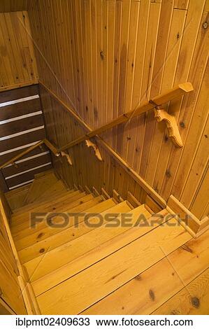 "Pinewood staircase leading to the downstairs floor in a Canadiana cottage style residential log home, Quebec, Canada - This image is property released for book, calendar, magazine, newspaper and editorial use only. " View Large Photo Image Stock Image - "Pinewood staircase leading to the downstairs floor in a Canadiana cottage style residential log home, Quebec, Canada - This image is property released for book, calendar, magazine, newspaper and editorial use only. ". Fotosearch