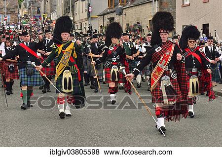 Stock Photo - "Pipe majors of various pipe bands leading the parade through the town, Dufftown, Moray, Highlands, Scotland, United Kingdom, Europe". Fotosearch