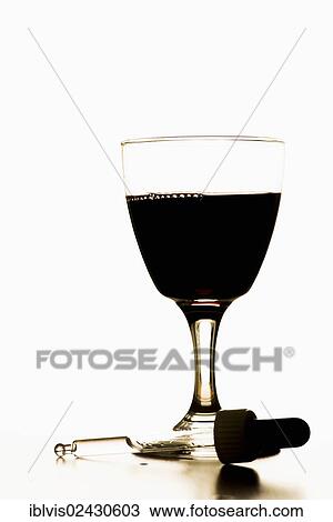 Pipette lying in front of glass filled with red wine View Large Photo Image Stock Image - Pipette lying in front of glass filled with red wine. Fotosearch