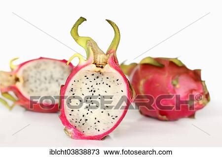 Stock Image - "Pitahaya or Dragonfruit (Hylocereus undatus), whole and halved fruit". Fotosearch