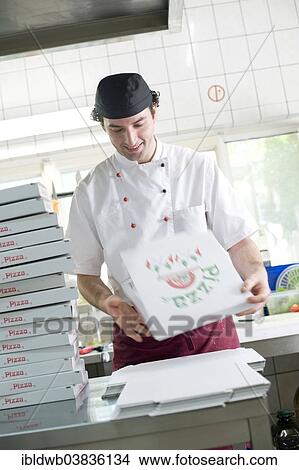 "Pizza baker folding a pizza box, Munich, Upper Bavaria, Bavaria, Germany, Europe" View Large Photo Image Picture - "Pizza baker folding a pizza box, Munich, Upper Bavaria, Bavaria, Germany, Europe". Fotosearch