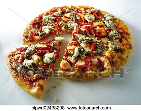 Stock Photo - Pizza topped with pesto chicken and red peppers. Fotosearch