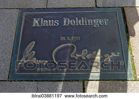 Stock Photo - "Plaque for the jazz musician Klaus Doldinger in the pavement of the """"Street of Fame"""", Burghausen, Upper Bavaria, Bavaria, Germany, Europe". Fotosearch