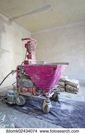 Picture - "Plastering machine for plastering interior walls, renovation of an old building, Stuttgart, Baden-Wuerttemberg, Germany, Europe". Fotosearch