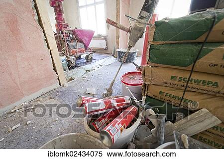 "Plastering machine for plastering interior walls, bags of plaster for machine application, renovation of an old building, Stuttgart, Baden-Wuerttemberg, Germany, Europe" View Large Photo Image Stock Photography - "Plastering machine for plastering interior walls, bags of plaster for machine application, renovation of an old building, Stuttgart, Baden-Wuerttemberg, Germany, Europe". Fotosearch
