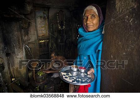 "Plate full of rupees, elderly woman collecting donations in a Shiva temple, Chittorgarh Fort, Chittorgarh, Rajasthan, India, Asia" View Large Photo Image Stock Photo - "Plate full of rupees, elderly woman collecting donations in a Shiva temple, Chittorgarh Fort, Chittorgarh, Rajasthan, India, Asia". Fotosearch