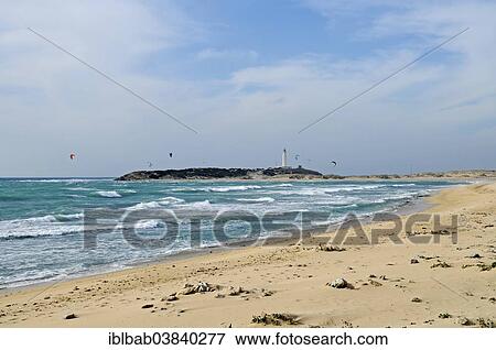 "Playa de Canos de Meca, beach, kitesurfers, Cabo de Trafalgar at the back, lighthouse, Barbate, Cadiz province, Andalusia, Costa de la Luz, Spain, Europe" View Large Photo Image Stock Photo - "Playa de Canos de Meca, beach, kitesurfers, Cabo de Trafalgar at the back, lighthouse, Barbate, Cadiz province, Andalusia, Costa de la Luz, Spain, Europe". Fotosearch