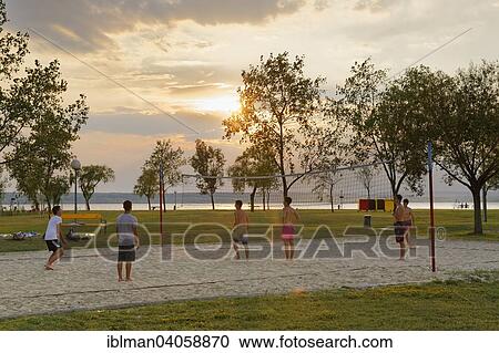 "Playing beach ball on Lake Neusiedl, Illmitz, Northern Burgenland, Burgenland, Austria, Europe" View Large Photo Image Stock Image - "Playing beach ball on Lake Neusiedl, Illmitz, Northern Burgenland, Burgenland, Austria, Europe". Fotosearch