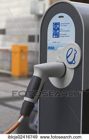 Plug, cable plugged into a charging station for electric cars, North Rhine-Westphalia, Germany, Europe View Large Photo Image Stock Photo - Plug, cable plugged into a charging station for electric cars, North Rhine-Westphalia, Germany, Europe. Fotosearch
