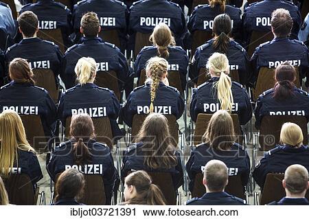 "Police commissioner candidates, trainees of the Polizei NRW or North Rhine-Westphalia Police, sitting at a meeting in an auditorium, North Rhine-Westphalia, Germany, Europe" View Large Photo Image Stock Image - "Police commissioner candidates, trainees of the Polizei NRW or North Rhine-Westphalia Police, sitting at a meeting in an auditorium, North Rhine-Westphalia, Germany, Europe". Fotosearch