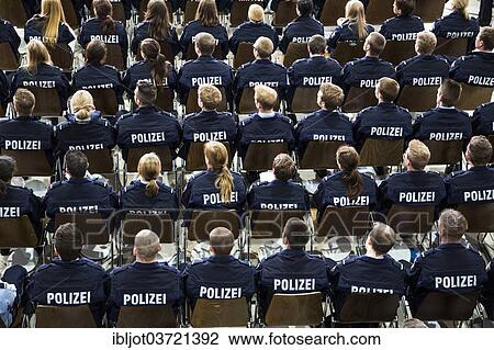 Stock Image - "Police commissioner candidates, trainees of the Polizei NRW or North Rhine-Westphalia Police, sitting at a meeting in an auditorium, North Rhine-Westphalia, Germany, Europe". Fotosearch