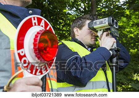 "Police during speed monitoring with a laser gun or hand-held laser meter, North Rhine-Westphalia, Germany, Europe" View Large Photo Image Stock Photo - "Police during speed monitoring with a laser gun or hand-held laser meter, North Rhine-Westphalia, Germany, Europe". Fotosearch
