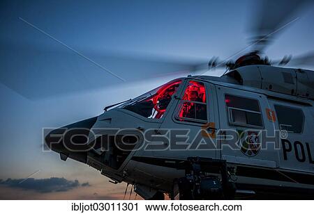 Stock Image - "Police helicopter type BK 117 taking off for an operational flight, Police Flying Squadron NRW, North Rhine-Westphalia, Germany, Europe". Fotosearch