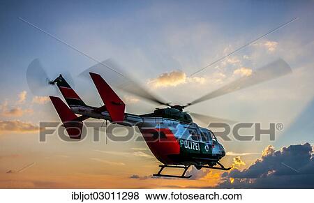 Stock Photo - "Police helicopter type BK 117 taking off for an operational flight, Police Flying Squadron NRW, North Rhine-Westphalia, Germany, Europe". Fotosearch