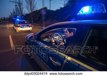 "Police patrol car in an emergency operation, with blue lights and sirens, Germany, Europe" View Large Photo Image Picture - "Police patrol car in an emergency operation, with blue lights and sirens, Germany, Europe". Fotosearch
