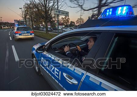 "Police patrol car in an emergency operation, with blue lights and sirens, Germany, Europe" View Large Photo Image Stock Image - "Police patrol car in an emergency operation, with blue lights and sirens, Germany, Europe". Fotosearch