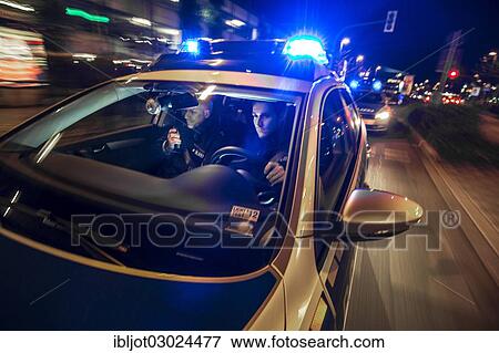 "Police patrol car in an emergency operation, with blue lights and sirens, Germany, Europe" View Large Photo Image Stock Photo - "Police patrol car in an emergency operation, with blue lights and sirens, Germany, Europe". Fotosearch
