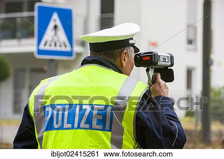 Policeman operating a laser speed gun, extensive speed controls in North Rhine-Westphalia on 24. 10. 2012, Recklinghausen, North Rhine-Westphalia, Germany, Europe View Large Photo Image Stock Image - Policeman operating a laser speed gun, extensive speed controls in North Rhine-Westphalia on 24. 10. 2012, Recklinghausen, North Rhine-Westphalia, Germany, Europe. Fotosearch