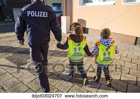 "Policeman showing the route to school to primary school children, Germany, Europe" View Large Photo Image Stock Photo - "Policeman showing the route to school to primary school children, Germany, Europe". Fotosearch