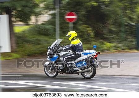 "Policeman wearing a yellow helmet on a motorcycle, police motorcycle patrol of the NRW Police, Germany, Europe" View Large Photo Image Stock Image - "Policeman wearing a yellow helmet on a motorcycle, police motorcycle patrol of the NRW Police, Germany, Europe". Fotosearch