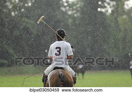 "Polo players in the rain, Ebreichsdorf, Lower Austria, Austria, Europe" View Large Photo Image Stock Photo - "Polo players in the rain, Ebreichsdorf, Lower Austria, Austria, Europe". Fotosearch