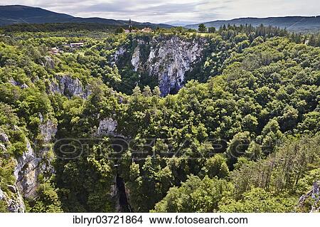 "Ponor or ravine, karst landscape, Skocjan Caves regional park, Divaca, Coastal–Karst Statistical Region, Slovenia, Europe" View Large Photo Image Picture - "Ponor or ravine, karst landscape, Skocjan Caves regional park, Divaca, Coastal–Karst Statistical Region, Slovenia, Europe". Fotosearch