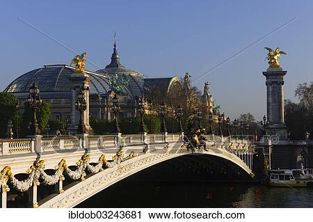 Stock Image - "Pont Alexandre III., Seine River and the Grand Palais, Paris, Ile-de-France, France, Europe". Fotosearch