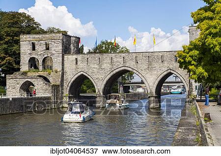 Stock Photo - "Pont des Trous bridge, part of the former city wall, across the river Scheldt, Tournai, Hainaut, Belgium, Europe". Fotosearch