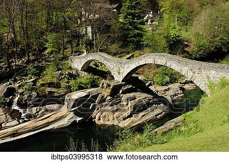"Ponte dei Salti pedestrian bridge in the Verzasca Valley spans the river Verzasca, Lavertezzo, Canton of Ticino, Switzerland, Europe" View Large Photo Image Stock Photo - "Ponte dei Salti pedestrian bridge in the Verzasca Valley spans the river Verzasca, Lavertezzo, Canton of Ticino, Switzerland, Europe". Fotosearch