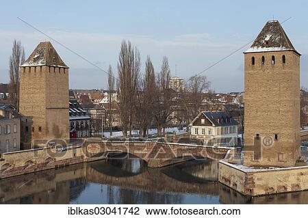 "Ponts couverts or covered bridges over the Ill River and towers of the city wall, Petite-France, Strasbourg, Departement Bas-Rhin, Alsace, France, Europe" View Large Photo Image Stock Image - "Ponts couverts or covered bridges over the Ill River and towers of the city wall, Petite-France, Strasbourg, Departement Bas-Rhin, Alsace, France, Europe". Fotosearch