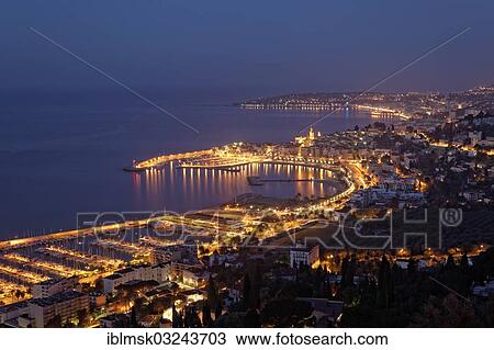 "Port and bay of Menton at the blue hour, Menton, French Riviera, Alpes-Maritimes, Provence-Alpes-Cote d? ÇÖAzur, France, Europe" View Large Photo Image Stock Image - "Port and bay of Menton at the blue hour, Menton, French Riviera, Alpes-Maritimes, Provence-Alpes-Cote d? ÇÖAzur, France, Europe". Fotosearch