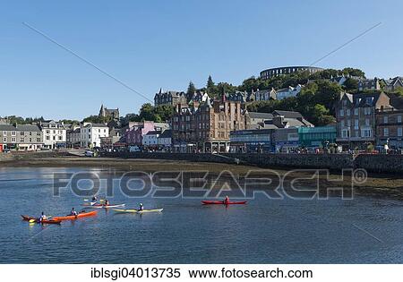 Stock Photography - "Port and McCaig's Tower on the hill, Oban, Scotland, United Kingdom, Europe". Fotosearch