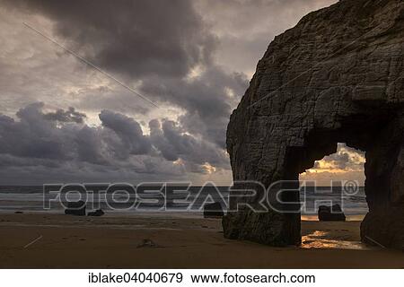 "Port Blanc natural arch at sunset, Quiberon Peninsula, Wild Coast, Brittany, France, Europe" View Large Photo Image Stock Photo - "Port Blanc natural arch at sunset, Quiberon Peninsula, Wild Coast, Brittany, France, Europe". Fotosearch