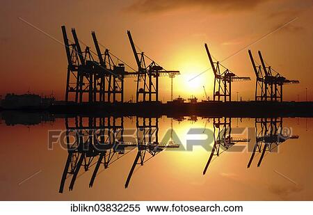 "Port cranes at sunrise with reflections, port, Altona, Hamburg, Germany, Europe" View Large Photo Image Stock Photography - "Port cranes at sunrise with reflections, port, Altona, Hamburg, Germany, Europe". Fotosearch